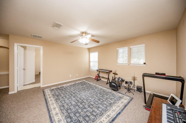 4609 Buescher Ct, Pearland, TX 77584 - workout area featuring baseboards, visible vents, a ceiling fan, and carpet floors