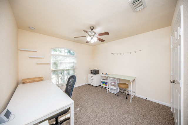 carpeted office with ceiling fan