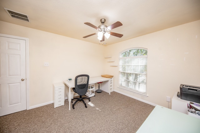 carpeted office with ceiling fan