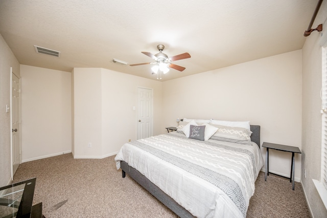 bedroom with light carpet and ceiling fan