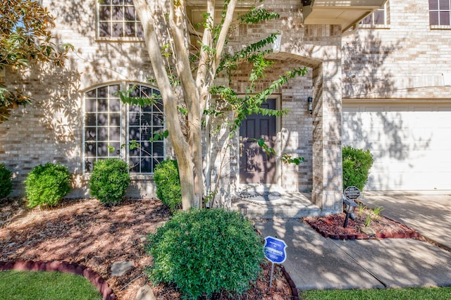 entrance to property featuring a garage