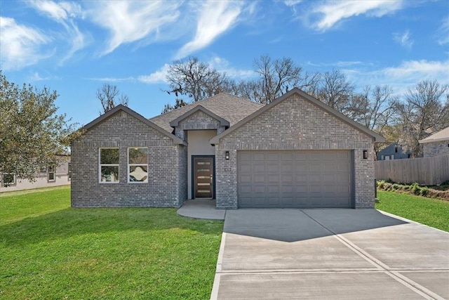 view of front facade featuring a front yard and a garage