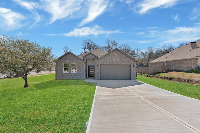 view of front of home with a front yard and a garage