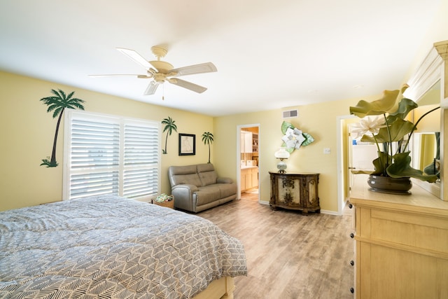 bedroom with light hardwood / wood-style flooring, ensuite bathroom, and ceiling fan