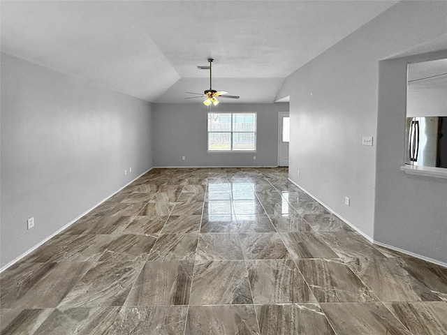 interior space with ceiling fan and lofted ceiling