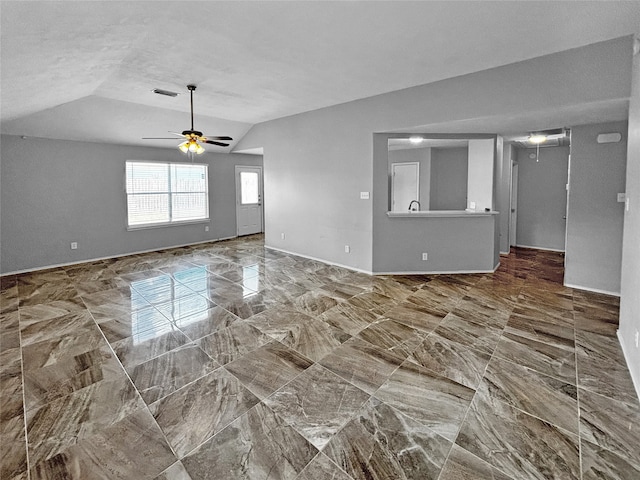 unfurnished living room with vaulted ceiling and ceiling fan