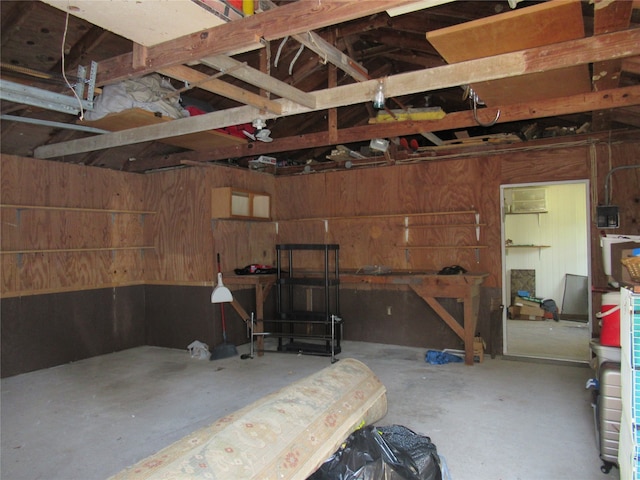 garage featuring wooden walls