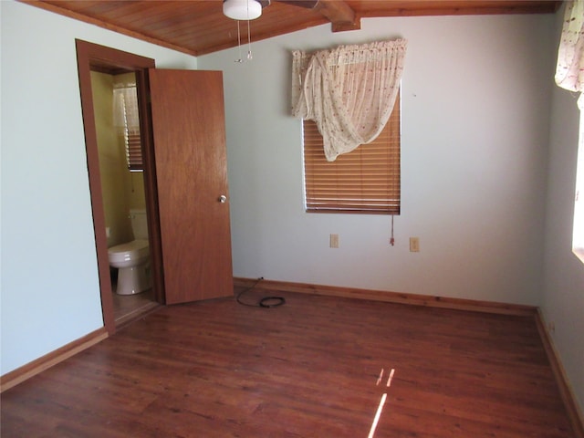 empty room featuring wood ceiling, vaulted ceiling, dark hardwood / wood-style floors, and ceiling fan