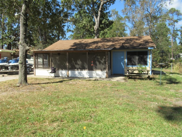 rear view of house with a lawn