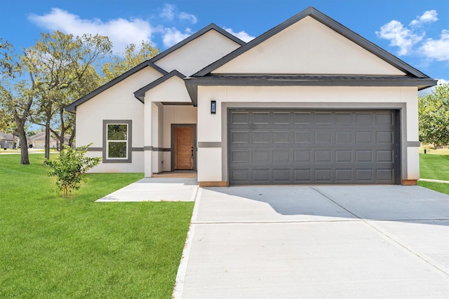 view of front of home with a garage and a front yard