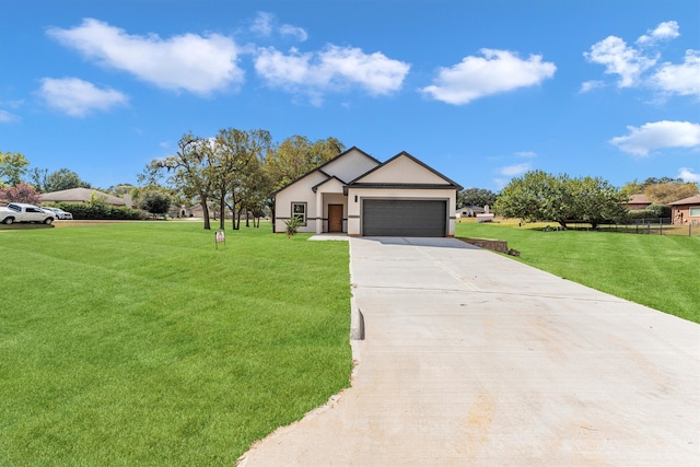 view of front of property with a garage and a front yard