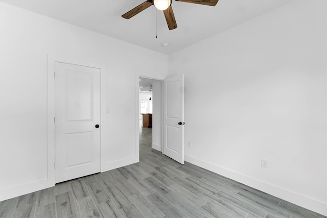 unfurnished bedroom with light hardwood / wood-style floors and ceiling fan