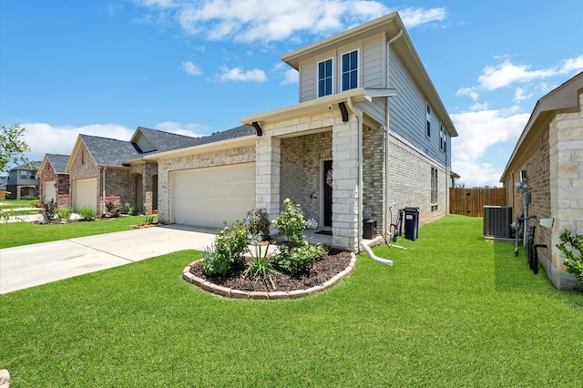 view of front facade featuring central AC, a front yard, and a garage