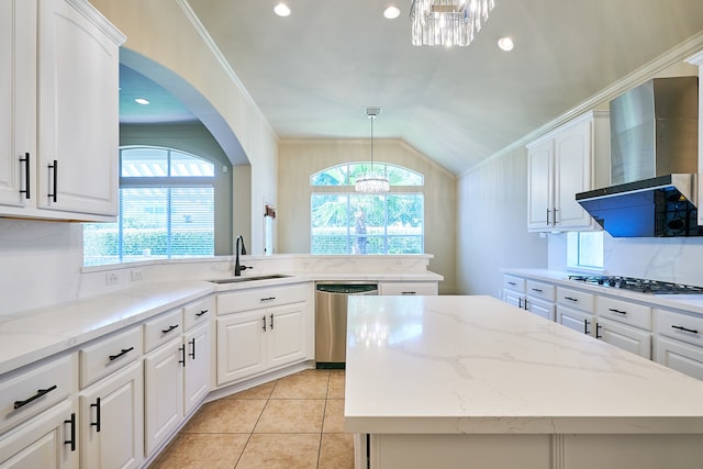 kitchen with sink, an inviting chandelier, and white cabinets