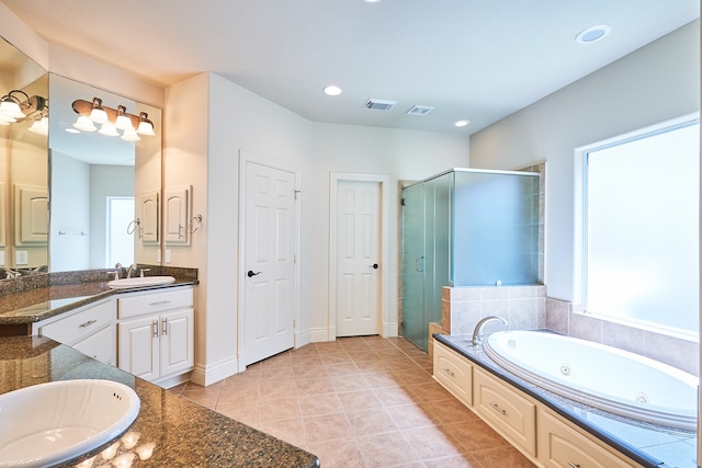 bathroom with vanity, tile patterned floors, and independent shower and bath