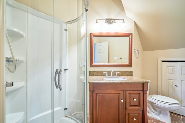 bathroom featuring a shower with shower door, toilet, tile patterned floors, lofted ceiling, and vanity