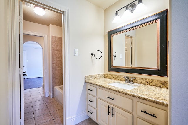 bathroom featuring vanity, a textured ceiling, and tile patterned flooring