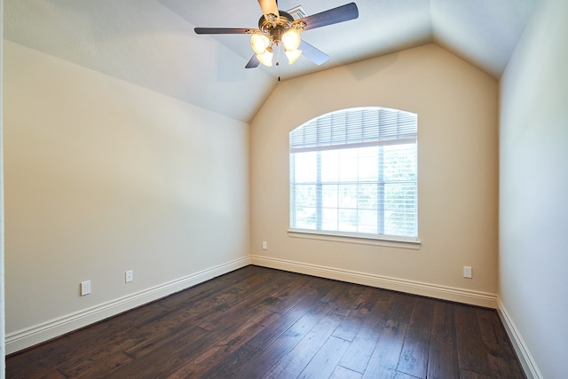 unfurnished room featuring lofted ceiling, dark wood-type flooring, and ceiling fan