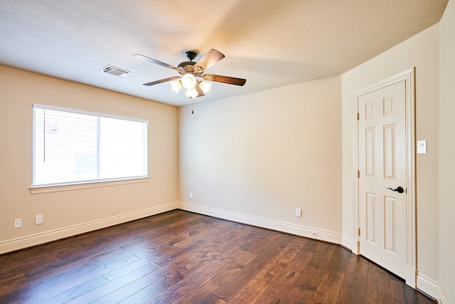 unfurnished room featuring ceiling fan, a textured ceiling, and dark hardwood / wood-style flooring