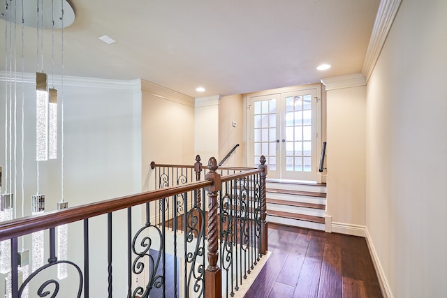 hall featuring french doors, ornamental molding, and dark hardwood / wood-style flooring