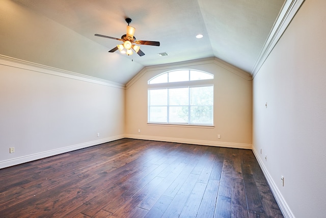 spare room with ceiling fan, crown molding, vaulted ceiling, and dark hardwood / wood-style floors