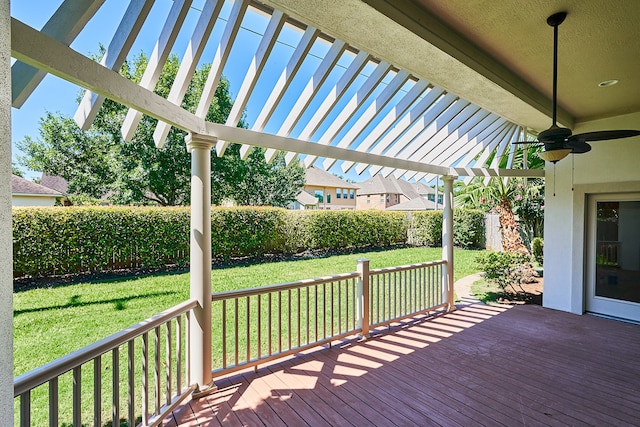 deck with a yard, ceiling fan, and a pergola