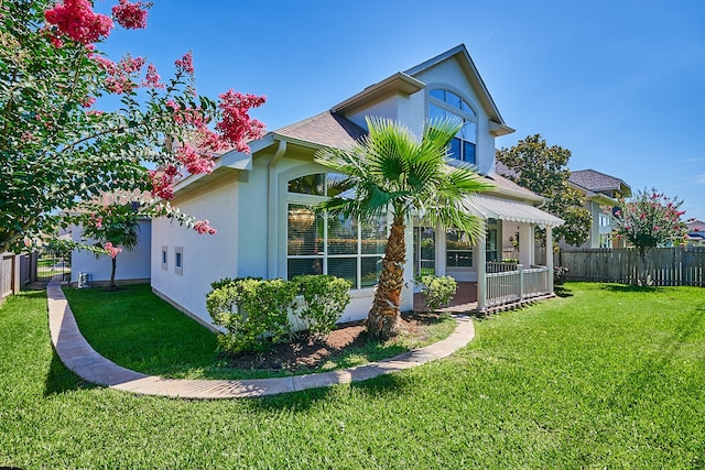 view of side of property featuring a yard