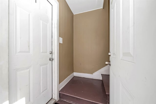 interior space featuring wood walls