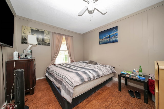 bedroom featuring ceiling fan and hardwood / wood-style floors