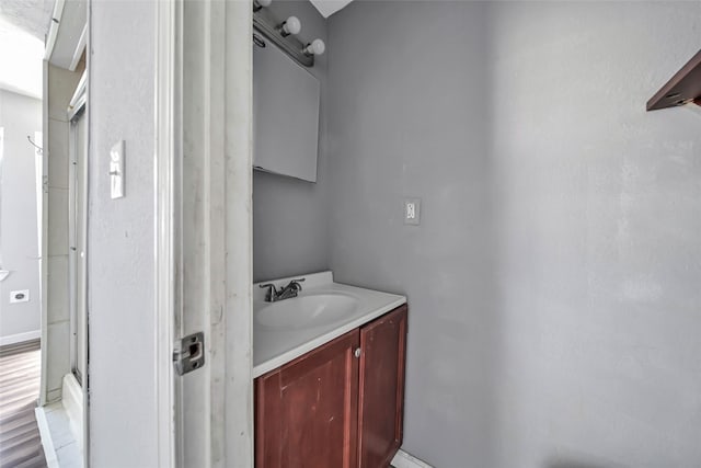 bathroom featuring vanity and hardwood / wood-style flooring