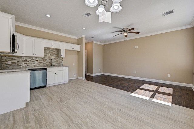 kitchen with ceiling fan, stainless steel appliances, light hardwood / wood-style flooring, and white cabinets