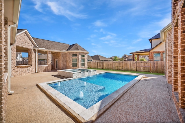 view of swimming pool with a patio area and an in ground hot tub