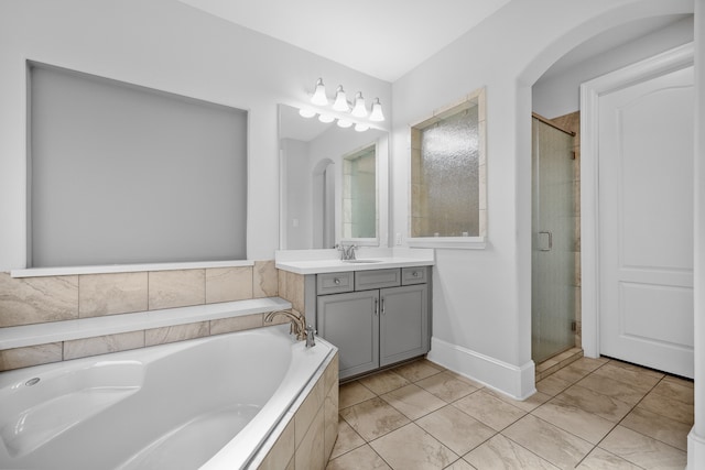 bathroom featuring vanity and separate shower and tub