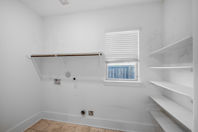 laundry room with gas dryer hookup, hookup for a washing machine, light tile patterned flooring, and electric dryer hookup