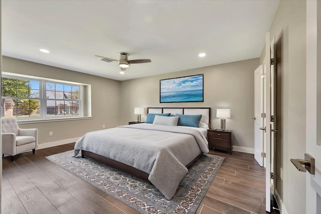 bedroom with dark wood-type flooring and ceiling fan