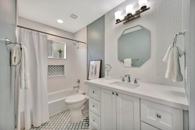 full bathroom featuring vanity, shower / bath combination with curtain, and toilet