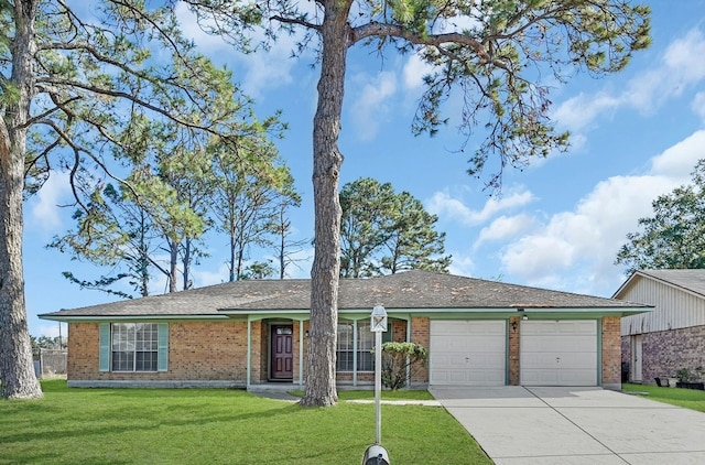 ranch-style home with a front yard, brick siding, driveway, and an attached garage