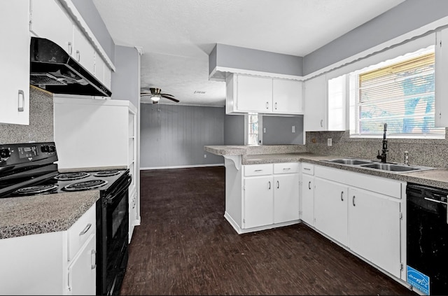 kitchen with black appliances, white cabinets, and dark hardwood / wood-style floors