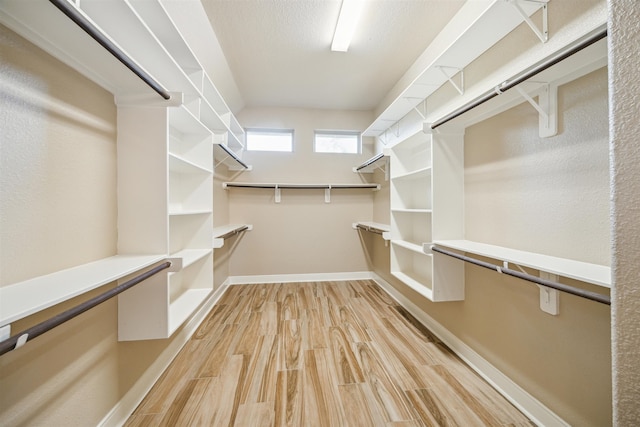 walk in closet featuring light wood-type flooring