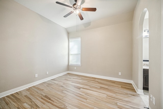 unfurnished room featuring vaulted ceiling, light hardwood / wood-style flooring, and ceiling fan