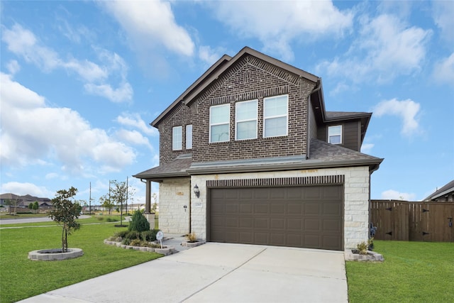 view of property featuring a front yard and a garage