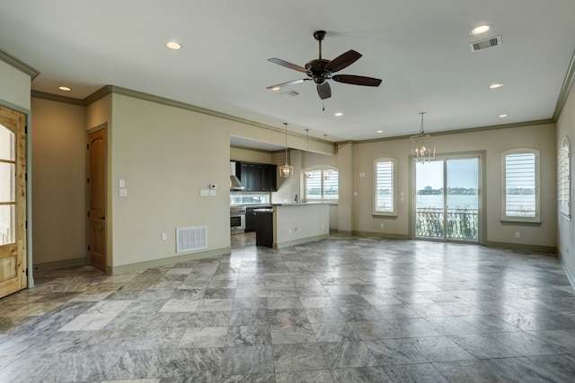 unfurnished living room with a healthy amount of sunlight, ornamental molding, sink, and ceiling fan with notable chandelier