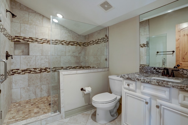 bathroom featuring lofted ceiling, toilet, a shower with shower door, vanity, and tile patterned flooring