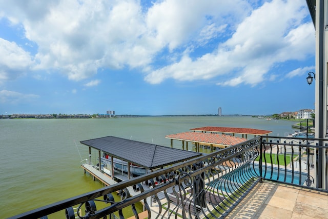 exterior space with a water view and a balcony