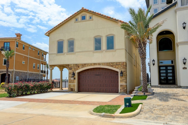 mediterranean / spanish house featuring a garage