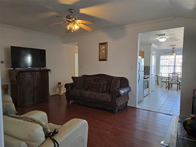 living room with ornamental molding, hardwood / wood-style floors, and ceiling fan