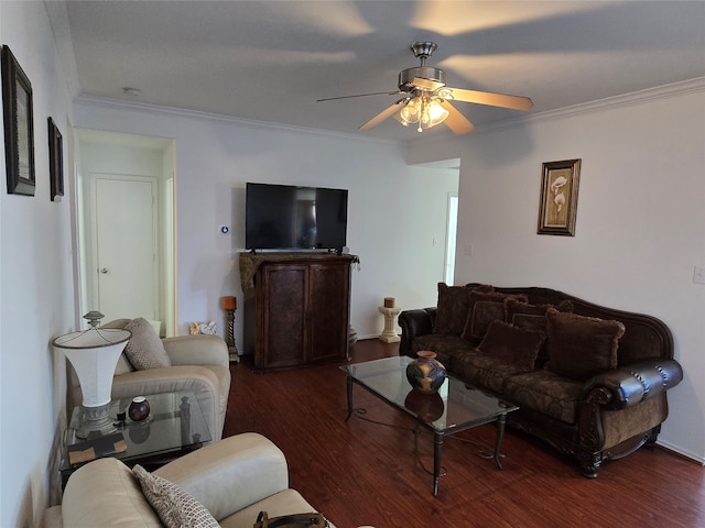 living room with crown molding, dark hardwood / wood-style floors, and ceiling fan