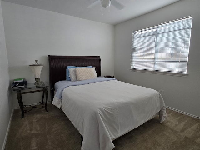 bedroom with dark carpet and ceiling fan