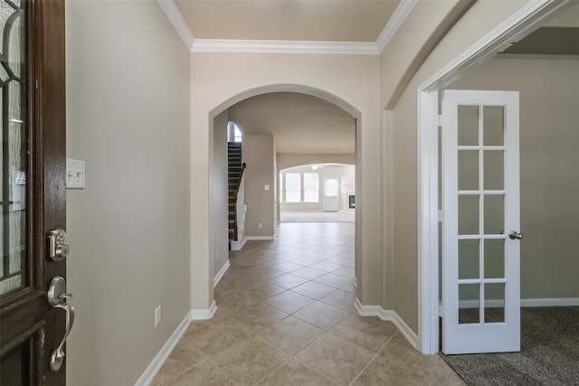 tiled entryway with crown molding