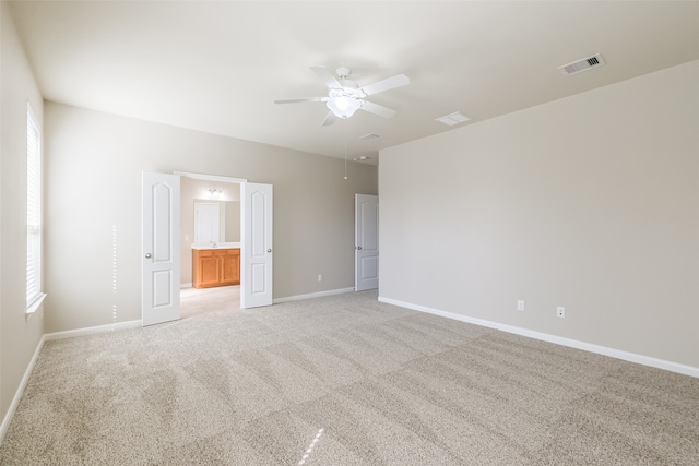 carpeted empty room with ceiling fan